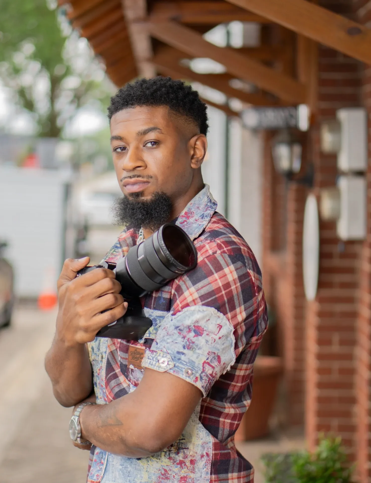 A man holding a camera in his hand.