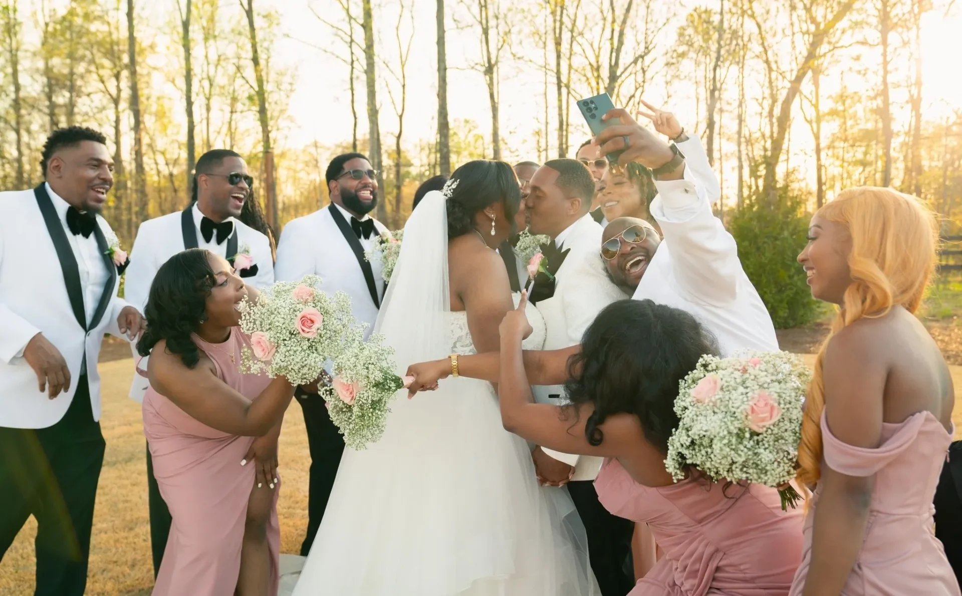 A group of people standing around each other.