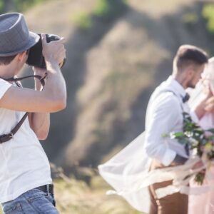A man taking a picture of some people