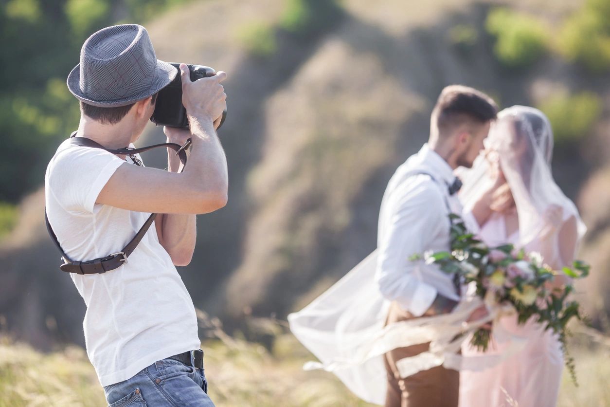 A man taking a picture of some people