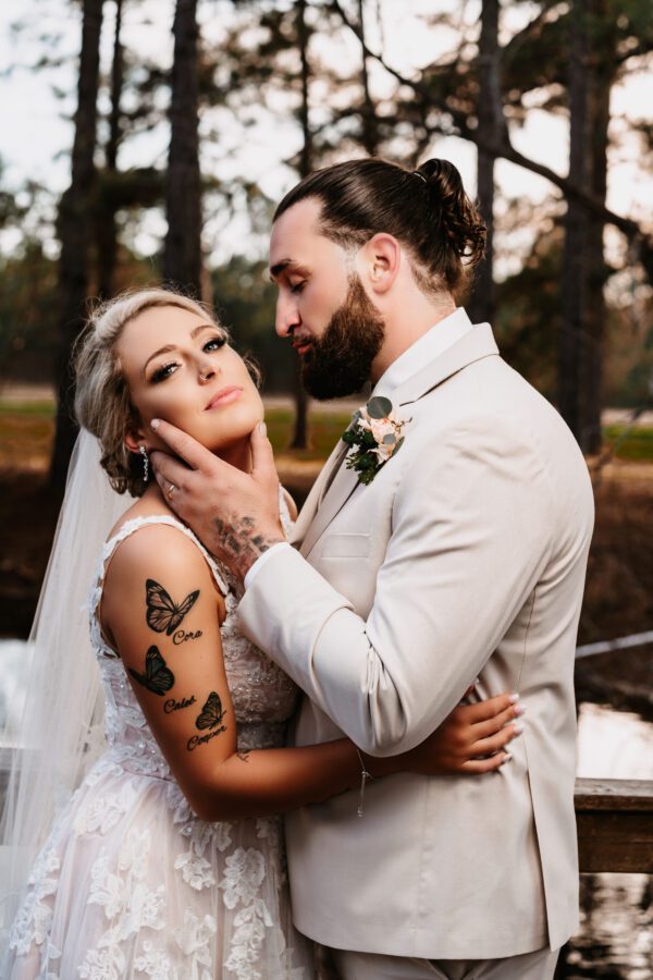 A man and woman are posing for the camera.